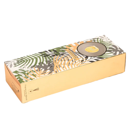These premium cardboard packaging boxes are specially designed for reed diffuser fragrance goods. The top surface features exquisite tropical plant leaf printing paired with a round transparent viewing window, and the side panel adopts elegant gold toned paper finish. Multiple box shapes including upright long boxes and flat horizontal boxes are available. High quality thick paper provides sturdy outer protection, custom made prints, window sizes and box dimensions are supported, ideal for home aromatherapy diffuser packaging, scented gift sets and large quantity wholesale orders.