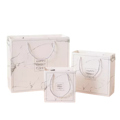 These elegant coated art paper bags feature delicate white marble texture and warm happy sweet times text print on smooth surface. Durable twisted paper rope handles offer comfortable grip and strong weight bearing capacity. Three optional sizes can satisfy different packaging demands for desserts cookies chocolates and small gifts. The premium coated paper ensures sharp vivid printing results. Custom logo and pattern printing service is available for brand promotion. These stylish gift bags are well suited for bakery shops party favors wedding presents and boutique retail packaging. Wholesale bulk orders are welcomed.