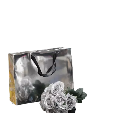 These glamorous special craft paper bags feature stunning glossy metallic silver mirror finish that delivers an eye catching luxurious appearance. Premium smooth black ribbon handles provide comfortable grip and great weight bearing performance. Thick laminated craft paper material maintains rigid shape and prevents surface scratches. Custom logo and pattern printing service is supported to highlight your brand image. These shiny gift bags work perfectly for jewelry cosmetics high end boutique shopping and special occasion presents. Wholesale bulk orders are welcomed.