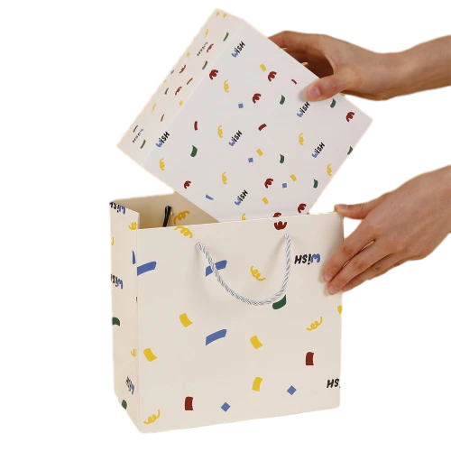 This playful gift box kit comes with a flip top custom rigid box and a matching rope handle paper tote bag, both decorated with lively multicolored confetti style prints and custom WISH letter printing. Made of thick sturdy paper material for anti deformation performance. You can fill the inner compartment with shredded paper filler, plush ornaments, perfume, snacks and assorted small size gifts. Custom printed surface patterns, brand logos and dimension adjustments are available, well suited for birthday surprises, party give aways, holiday gift giving and wholesale order customization.