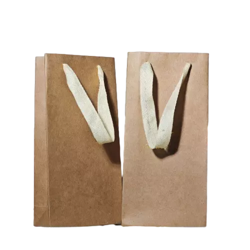 These tall slim kraft paper bags are made of thick natural brown kraft paper with soft and sturdy cotton ribbon handles for comfortable carrying. The vertical narrow shape provides perfect fit for wine bottles coffee bottles and other tall gifts. Blank plain surface leaves enough space for your custom logo and artwork printing. Eco friendly reusable material is suitable for liquor shops beverage stores and gift retail packaging. Large quantity wholesale service is available.