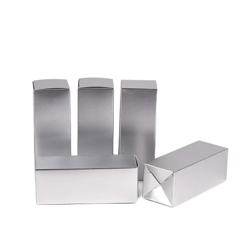 These premium metallic silver cardboard cartons come in multiple tall rectangular specifications and can be stored as flat unfolded sheets for convenient transportation. The glossy mirror like silver surface delivers a high end metallic texture. Made of tough fold able cardstock with stable auto lock bottom structure, these blank boxes are well suited for lipstick, perfume bottles and assorted cosmetic supplies. Custom sized measurements, surface printing and special surface treatments are supported, perfect for luxury commodity packaging and large batch wholesale supply.
