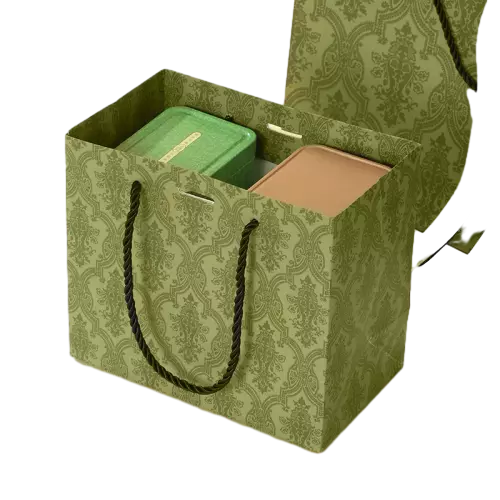 These elegant special craft paper bags are printed with delicate vintage damask floral pattern on soft olive green background. Heavy duty black twisted rope handles provide solid support and comfortable grip. Thick high grade craft paper keeps the tote upright and durable for repeated use. Custom logo and pattern printing options are available to meet personalized branding demands. This timeless styled paper bag works wonderfully for tea sets snacks cosmetics and premium holiday gift packaging. Wholesale bulk orders are welcomed.