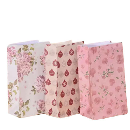 These versatile coated art paper bags come in three beautiful decorative styles including hydrangea blossom print pink flower pattern and festive Christmas ornament design. Strong twisted paper rope handles bring secure and comfortable carrying experience. The smooth coated paper surface delivers vivid clear printing effect. You can select single design or mix different patterns for your order. Custom logo and artwork printing service is supported for brand promotion. These lovely gift bags fit well for holiday celebrations birthday presents wedding favors and boutique retail merchandise packaging. Wholesale bulk orders are welcomed.