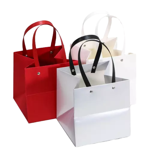 These premium special craft paper bags adopt smooth matte solidcolor surface with spacious square bottom design. Wide satin ribbon handles are firmly fixed by metal rivets for extra reinforcement and longtime durability. Thick craft paper keeps the tote upright and prevents side collapse under loaded weight. You can add custom logo text and graphic printing on the outer surface for brand promotion. These elegant multicolor paper bags are well suited for cosmetics jewelry clothing and all kinds of festive gift packaging. Wholesale bulk orders are welcomed