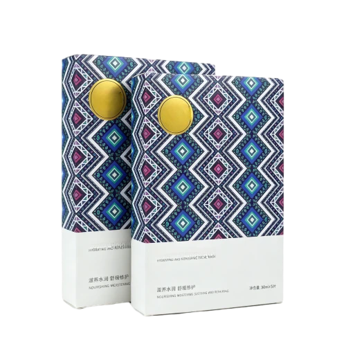 This vertical custom cardboard box is made of high quality coated paper with elegant matte surface finish. The upper section can be printed with colorful ethnic geometric patterns and decorated with round gold sealing sticker. Product descriptions net weight information and brand content can be printed on the bottom white area. You are able to customize box sizes color schemes graphic designs and text content to hold facial masks and other skincare items. The firm cardboard shell keeps inner cosmetic sheets clean and well protected during transportation and beauty shop shelf display. It is a stylish decorative packaging solution for skincare brand suppliers and large volume wholesale orders.