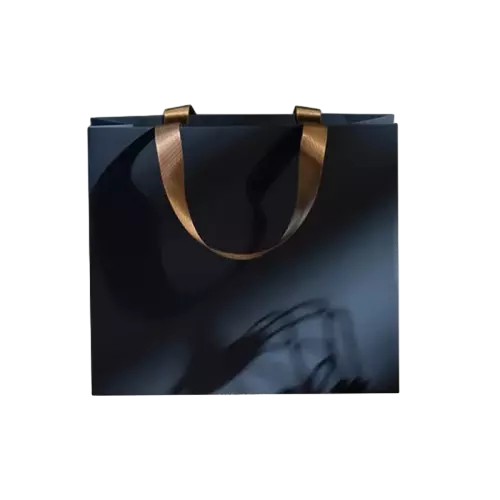 These premium special craft paper bags feature elegant glossy black surface that delivers a luxurious visual effect. Wide golden satin ribbon handles bring comfortable carrying experience and outstanding load bearing performance. The large horizontal design provides ample inner room for various high value goods. Thick high quality coated paper keeps the bag well shaped and scratch resistant. You can add custom hot stamping logo text and patterns on the smooth surface for brand display. This sophisticated paper bag works perfectly for jewelry cosmetics luxury gifts and upscale boutique packaging. Wholesale bulk orders are welcomed