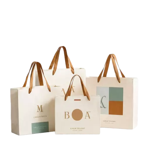 These minimalist special craft paper bags adopt soft offwhite matte paper and come in a full range of practical sizes. Warm brown wide fabric ribbon handles offer comfortable grip and strong supporting force. Stylish geometric shapes and letter prints bring fresh artistic appeal to the bag exterior. Thick high grade paper keeps the tote upright and durable under daily load. Custom service is available for your unique logo lettering and graphic designs to build exclusive brand style. These elegant paper bags fit well for clothing retail coffee shops cosmetic stores and festival gift packaging. Wholesale bulk orders are welcomed.