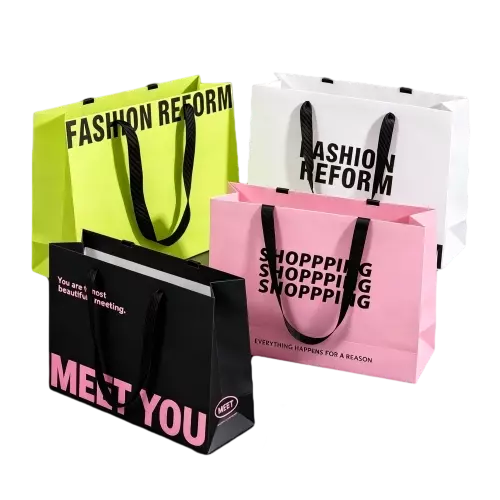 These trendy special craft paper bags come in a selection of vivid fashionable colors with eye catching bold slogan prints on the outer surface. Durable wide black fabric ribbon handles provide comfortable carrying experience and excellent load bearing performance. Spacious horizontal interior space is well suited to hold clothes accessories and other retail goods. Thick sturdy paper maintains good shape and resists bending during daily shopping use. You can replace the original printed text with your custom logo slogan and graphic patterns for brand promotion. These stylish paper bags are ideal packaging options for fashion clothing shops boutique stores and casual gift delivery. Wholesale bulk orders are welcomed.