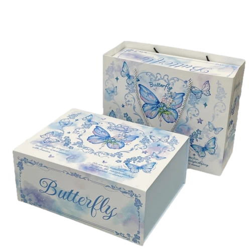 This elegant custom rigid box is made of high quality thick hardboard with smooth matte paper finish. Delicate watercolor blue butterflies and vintage floral ornaments decorate the whole box surface. Cursive butterfly lettering is printed on the front for an artistic romantic touch. Hidden magnetic flip lid supports easy opening and stable closing. It can be matched with the same printed paper gift bag to provide a full set of premium packaging solution. The spacious inner space can hold cosmetics perfumes jewelry candles and various luxury gift items. You are allowed to adjust butterfly illustrations text content and background colors to suit wedding favors birthday gifts and holiday giveaways. Its solid rigid shell provides reliable protection for contents during transit and retail display. It is a beautiful high end packaging choice for gift retailers and large volume wholesale orders.