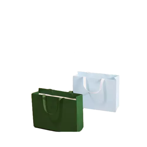 These plain solid color paper gift bags are made of high quality thick kraft paper with smooth matte finish. Soft fabric ribbon handles provide comfortable grip and strong load bearing capacity. Multiple color options are available to match different brand styles. The clean blank exterior allows you to print custom logo brand slogan and decorative artwork. Spacious horizontal interior is suitable for clothing cosmetics gifts and various retail goods. These simple versatile tote bags are perfect packaging choices for boutique shops brand retail and daily gift delivery. Wholesale bulk orders are welcomed.