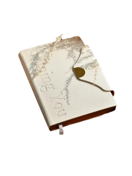 These elegant hardcover notebooks adopt premium textured PU leather covers with delicate embossed letter details and a unique envelope style flap fitted with gold magnetic buckle, presenting a minimalist luxury aesthetic suitable for both business and personal scenarios. Built with a practical ribbon bookmark for quick page locating and thick premium lined inner pages that ensure smooth writing performance and effectively prevent ink bleedthrough, they are perfect for work planning, meeting minutes and daily journaling. The slim portable design fits easily into handbags for on the go use, and the cover supports custom logo printing to satisfy brand personalization demands. They serve as high-end stationery gifts for corporate clients and employees, ideal for boutique retail and bulk wholesale procurement.