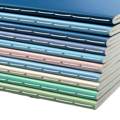 These minimalist soft cover notebooks adopt premium matte solid color outer covers with full range soft Morandi and macaron toned colour selections. Adopted durable long stitch sewing binding for flat lay flat opening and long term usage. Available in A5 and B5 common sizes. High density thick lined inner pages deliver fluent handwriting and guard against ink seepage. The plain style cover supports custom sticker, brand label and logo printing. Suited for workplace records, school coursework, meeting notes and daily planning, fit for bulk stationery orders and resale.