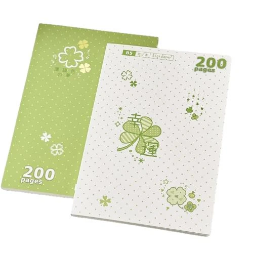 These B5 soft cover notebooks contain 200 premium writing friendly pages. Two classic cover styles consist of green polka dot and off white polka dot surface, decorated with delicate four leaf clover lucky motif artwork. Sew on stitch binding lets the notebook lay fully flat while writing, avoiding page curling. The fresh style appearance fits school coursework recording, everyday diary keeping, office memos and souvenir gifts. Custom cover printing, pattern modification and brand logo imprinting are acceptable for bulk wholesale orders.