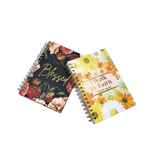 This series of metal spiral bound notebooks is equipped with multiple exquisite cover styles, including water color daisy prints, dark background peony artwork and minimalist black planner cover with golden inspirational lettering. Smooth durable metal spiral binding permits flat lay open writing. The premium thick inner pages adopt lined layout and contain a name writing area on the opening page. Suitable for religious devotion notes, daily goal planning, travel journals and gift giving. Custom made surface printing, slogan customization and brandlogo imprinting are supported for large batch wholesale orders.