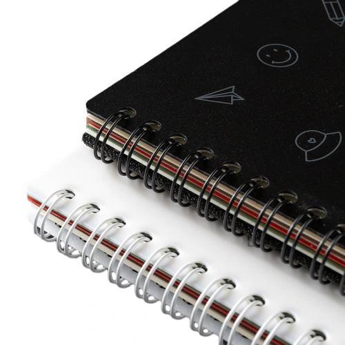 This metal coil spiral bound notebook comes in black and white cover options printed with delicate outlined lifestyle icons like paper planes, smiley faces and stationery motifs. Built in multicolored index divider tabs help you classify records conveniently. Sturdy double spiral metal binding enables 360 degree page flipping without snagging. The thick ink resistant lined pages prevent ink penetration. Ideal for student coursework notes, daily planners, workplace memos and travel journals. Custom cover prints and brand logo stamping are supported for bulk wholesale orders.