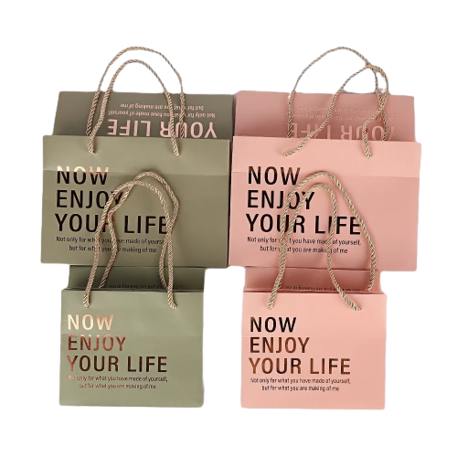 Special Craft Paper Bags adopt minimalist matte solid color design with elegant hot stamping inspirational letter print. Available in olive green and soft pink with multiple sizes to pick from. Thick twisted paper rope handles are sturdy and comfortable to hold. Premium thick craft paper keeps the bag rigid and maintains neat shape. The simple text pattern delivers warm positive vibe for gift giving. We support custom bag size base color printed text and brand logo. These bags work well for cosmetic store packaging birthday gifts daily shopping and small gift set packing.