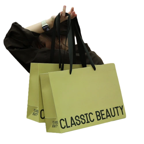 Special Craft Paper Bags feature minimalist matte khaki surface printed with bold Classic Beauty lettering. Wide black ribbon handles are soft and firmly attached for comfortable carrying. Thick high quality craft paper keeps the bag rigid and holds shape well. The simple advanced design matches beauty salon cosmetic shop and fashion brand style. We support custom bag size base color printed words and brand logo. These paper bags are ideal for daily shopping beauty product packing and brand gift giving.