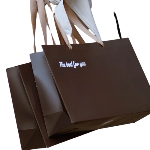 Special Craft Paper Bags feature elegant dark brown matte surface printed with delicate white slogan The best for you. It comes with matching brown ribbon handles which are soft and durable. Thick sturdy craft paper keeps the bag rigid and holds its shape well. Simple and classy design fits many gift giving occasions. We support custom bag size base color printed text and brand logo. These paper bags are perfect for clothing boutiques cosmetic shops birthday gifts and festival gift sets.