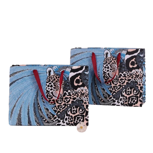 Special Craft Paper Bags feature striking exotic jungle artwork combined with leopard portrait and soft blue feather elements. Vibrant red wide ribbon handles offer smooth and solid grip for daily carry. Thick premium craft paper keeps the bag upright and retains its shape well. The bold artistic print delivers distinctive visual charm and highlights unique brand taste. We support custom bag size base color artwork and brand logo. These paper bags fit fashion retail packaging luxury gift delivery boutique shopping and special occasion gift sets.