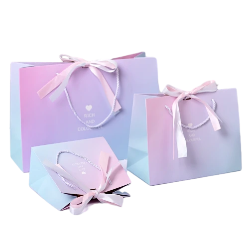 Special Craft Paper Bags feature beautiful pastel gradient surface printed with delicate heart and letter patterns. Equipped with sturdy white twisted rope handle and matched pink satin bow decoration to add sweet romantic vibe. Thick premium craft paper maintains nice shape and good loading capacity. Three available sizes meet diverse packaging needs for small gifts and cosmetics. Soft gradient color brings dreamy visual effect popular for gift giving occasions. We support custom bag size printed pattern logo and surface color. These paper bags fit candy packaging cosmetic gifts birthday presents wedding favors and holiday gift sets.