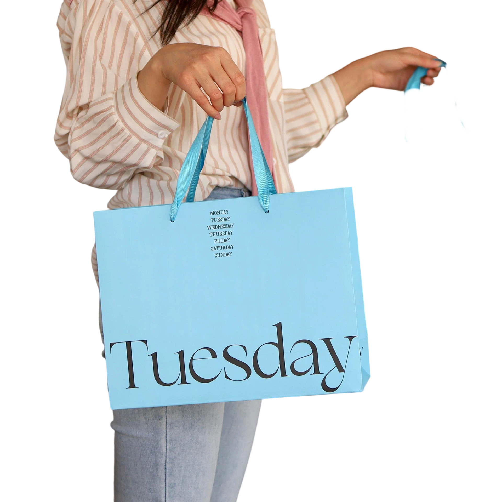 Special Craft Paper Bags adopt fresh light blue surface printed with elegant large Tuesday serif letter and stacked weekly text above. Matching light blue ribbon handles are smooth and sturdy for comfortable carrying. Thick premium craft paper keeps the bag upright and maintains neat shape. The soft blue tone combined with delicate typography creates minimalist trendy style for brand retail and gift delivery. We support custom bag size base color printed text and brand logo. These paper bags fit fashion boutique shopping cosmetic packaging birthday gifts and holiday gift sets.