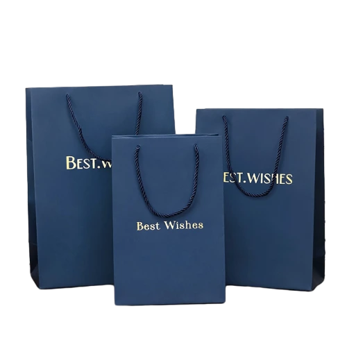 Special Craft Paper Bags adopt premium matte navy blue paper with elegant gold foil Best Wishes letter printing. Sturdy navy twisted rope handles deliver stable load bearing and simple stylish look. Three available sizes meet different packaging requirements for small and large gifts. Thick craft paper keeps the bag upright and maintains smooth matte surface. The noble deep blue tone paired with shiny gold foil creates sophisticated gift vibe. We support custom bag size base color foil text and brand logo. These paper bags fit wedding favors cosmetic gifts birthday presents corporate gifts and holiday gift sets.