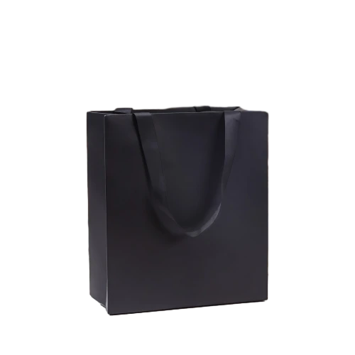 Special Craft Paper Bags adopt premium matte black paper with smooth blank surface. Wide matching black satin ribbon handles offer comfortable grip and premium visual effect. Thick craft paper makes the bag rigid and keeps upright shape. Blank surface supports various custom printing such as logo text and patterns. Minimalist solid black design delivers modern luxury feeling for brand shopping and gift packing. We support custom bag size base color and printing artwork. These paper bags fit fashion store shopping cosmetic packaging corporate gifts birthday presents and holiday gift sets.