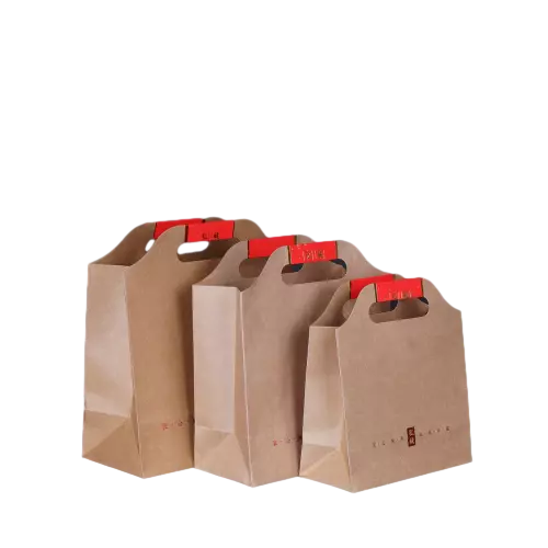 These custom kraft paper bags are made of highdensity natural brown kraft paper with integrated diecut cutout handles for easy hand carrying. The reinforced folded bottom delivers strong load bearing performance to hold tea tins dry food and heavy gift items. Red decorative label stickers are matched on handle positions, and custom red text or patterns can be printed on bag surfaces. Thick paper material prevents tearing and deformation in transportation. You are allowed to customize bag dimensions handle shape printing content sticker design and brand logo. It is ideal for tea packaging local specialties homemade snacks holiday gifts and traditional Chinese style souvenir packaging.