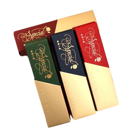 This elegant long sliding drawer cardboard box adopts classic twotone color matching design. The upper section can be finished with rich dark red dark green or navy blue surface with shiny gold foil script and small rose decoration. The lower gold section is added with embossed Best Gift text for extra premium touch. The smooth slide out structure makes it easy to take out inner goods. Sturdy thick cardboard keeps the long slim shape stable. You can change surface colors foil printing content embossed logo and box length size. It fits well for chocolate candy small dessert wedding favors wedding guest gifts and mini festival souvenir packaging.