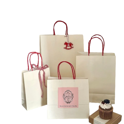 Coated Art Paper Bags adopt clean off white base with bright red paper rope handles. Multiple sizes meet different packaging needs for cakes desserts and small gifts. You can match with decorative bows hanging tags and custom printed stickers to enrich package details. Smooth paper surface supports clear printing of logos patterns and warm text. Sturdy paper structure maintains bag shape while carrying items. We offer custom size custom print and accessory matching service. Widely used in bakery shops birthday parties wedding favors baby shower and boutique retail gift packaging.