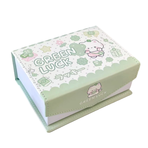 This lovely custom rigid magnetic gift box features fresh white and light green color scheme. The full printed surface is decorated with cute cartoon cat clover flower and polka dot elements. Clear text and small cartoon patterns can be printed on the side flap. Hidden magnet keeps the lid firmly closed. Thick premium rigid cardboard maintains neat rectangular shape. You can customize cartoon illustrations color matching printed text brand logo and box dimension. It fits well for stationery sets candy gifts small cosmetic items kids birthday favors and sweet surprise gift packaging.