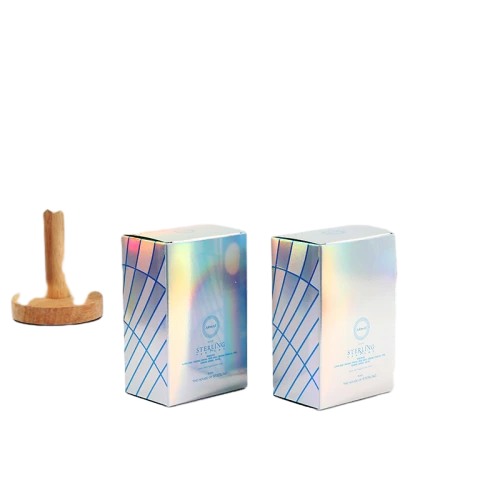 This medium sized custom cardboard box is wrapped with stunning holographic silver paper that shows beautiful rainbow color shifts under light. Crisp blue geometric intersecting lines are printed on the outer panel along with brand logo and product information. Standard tuck top foldable design supports flat shipment to save logistics cost. Rigid thick cardboard provides solid protection for perfume bottles fragrance jars and cosmetic containers. You can adjust holographic effect geometric graphic printed text and brand logo. It fits well for perfume bottles reed diffuser sets fragrance products beauty accessories and luxury cosmetic gift packaging.